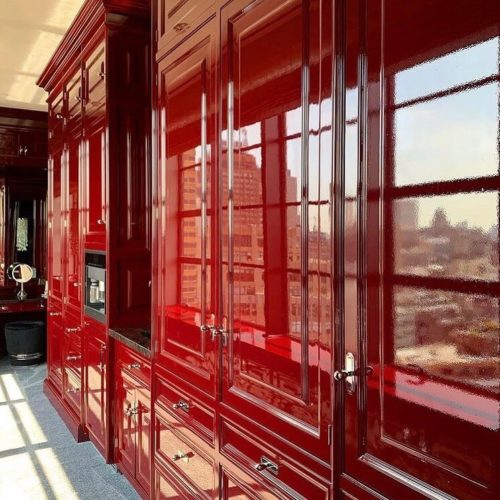 photo of large cabinet in house painted with a high gloss red paint.