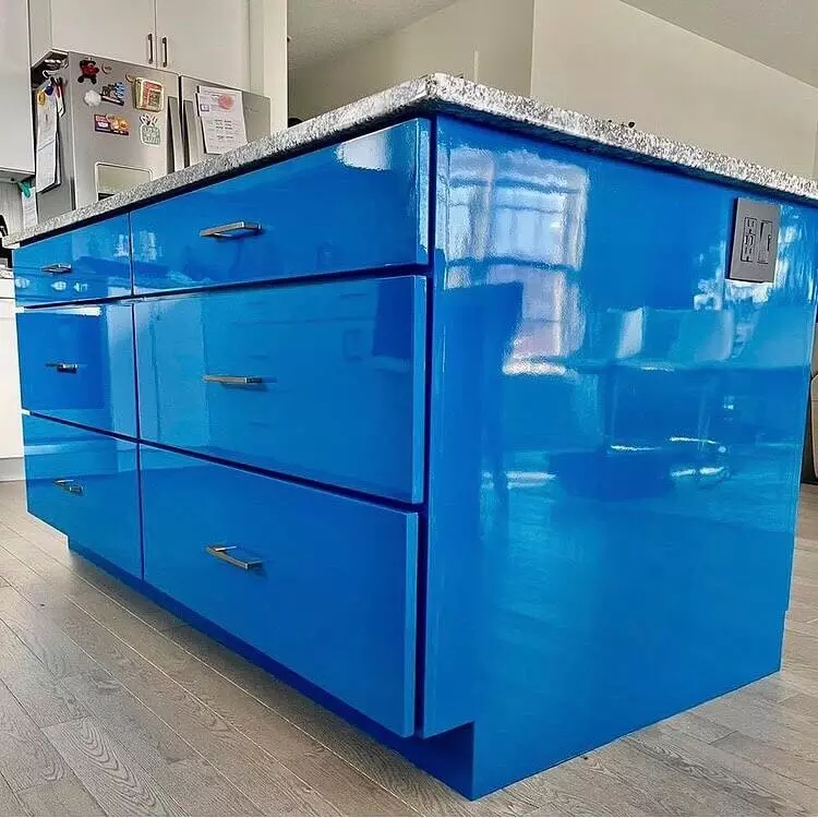 photo of kitchen island painted blue in high gloss paint.