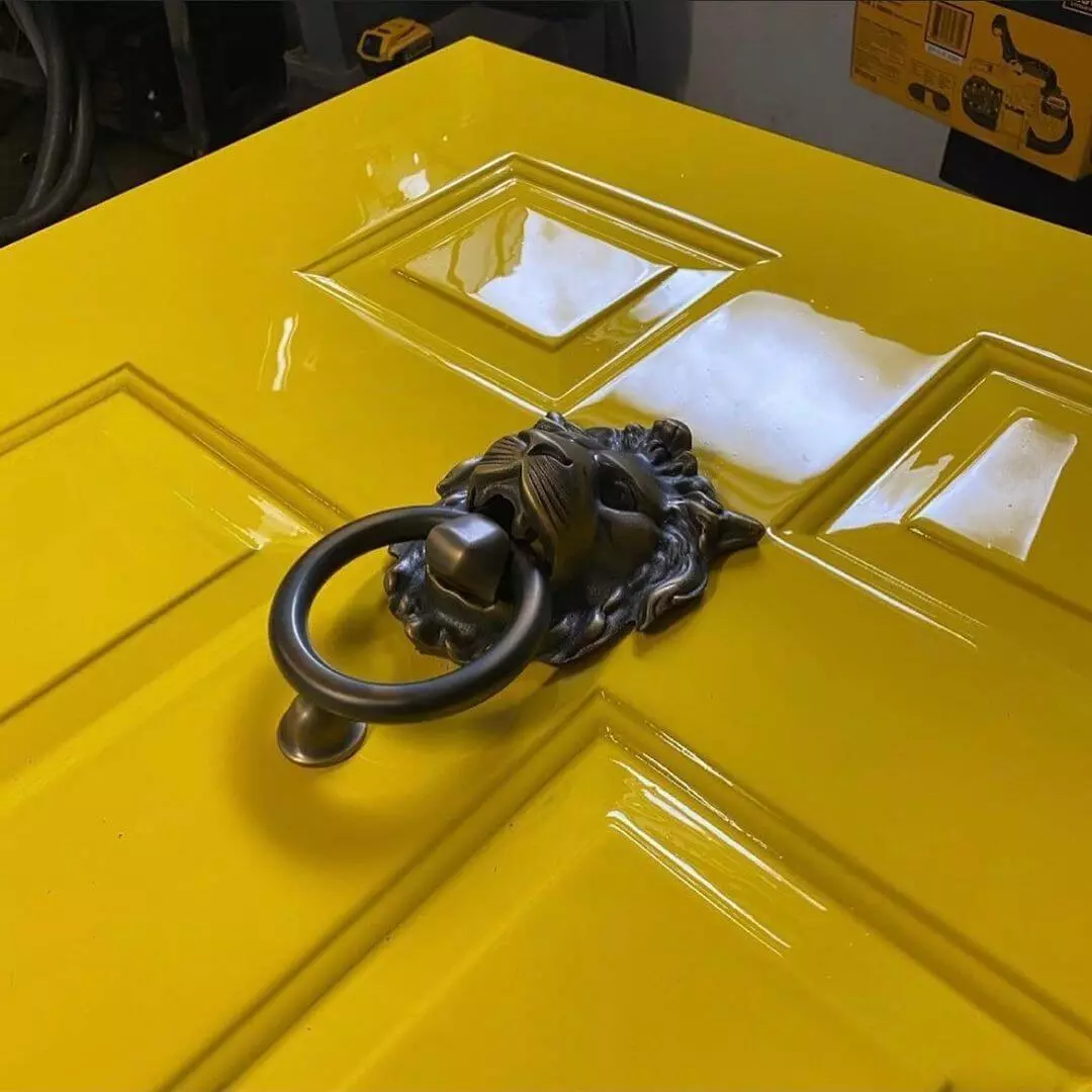 photo of close up of door painted with high gloss yellow paint